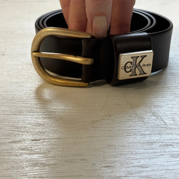 VTG Calvin Klein Jeans Dark Brown Molded Rubber Belt L 31”-35” Hole Range - Picture 1 of 7